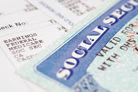 A Social Security card with numbers from a paycheck